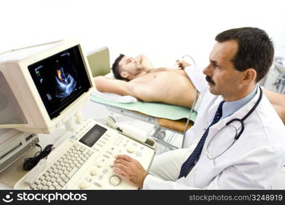 Doctor performing an ultrasound heart scan on young male patient. Real people, real locacion, real image on the screen, not a staged photo with models.