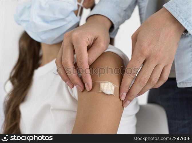 doctor placing bandage little girl s arm close up