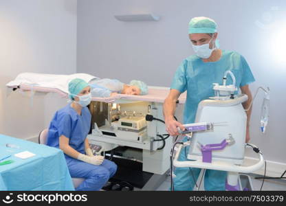 Doctor preparing equipment for medical procedure