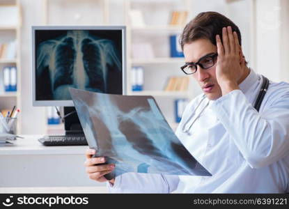 Doctor radiologist looking at x-ray images