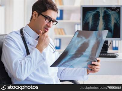 Doctor radiologist looking at x-ray images. The doctor radiologist looking at x-ray images