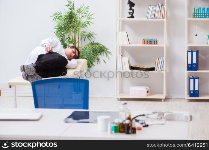 Doctor relaxing after complex surgery in hospital