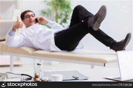 Doctor relaxing after complex surgery in hospital. The doctor relaxing after complex surgery in hospital