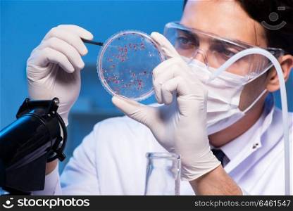 Doctor researching new virus in lab at night