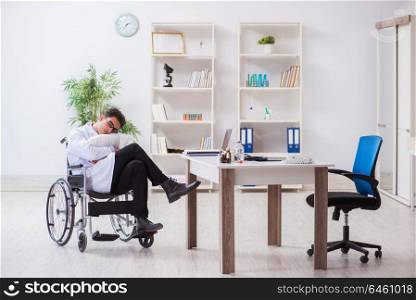 Doctor resting on wheelchair in hospital after night shift