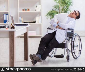 Doctor resting on wheelchair in hospital after night shift. The doctor resting on wheelchair in hospital after night shift