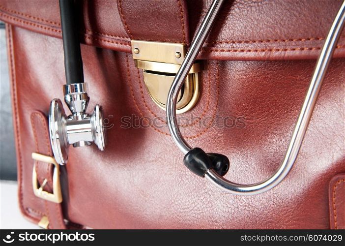 Doctor&rsquo;s brown leather case with the stethoscope