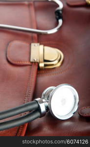 Doctor&rsquo;s brown leather case with the stethoscope