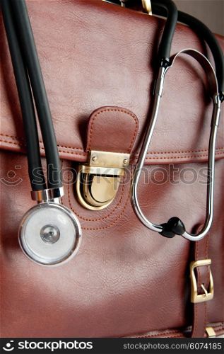 Doctor&rsquo;s brown leather case with the stethoscope