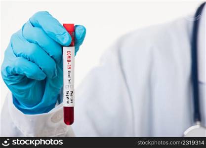 Doctor scientist in white uniform wear a mask holding test tube Coronavirus test blood sample in a clinical laboratory for analyzing isolated on white, medicine COVID-19 pandemic outbreak concept