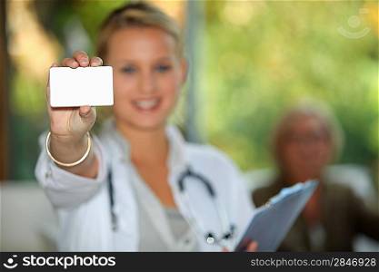 Doctor showing business card