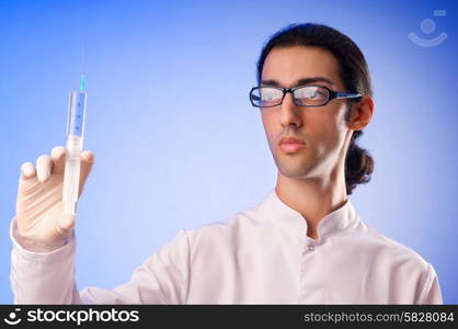 Doctor sitting at the desk on white