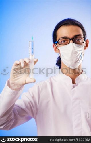 Doctor sitting at the desk on white