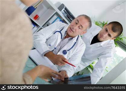 doctor sitting with male patient at the desk