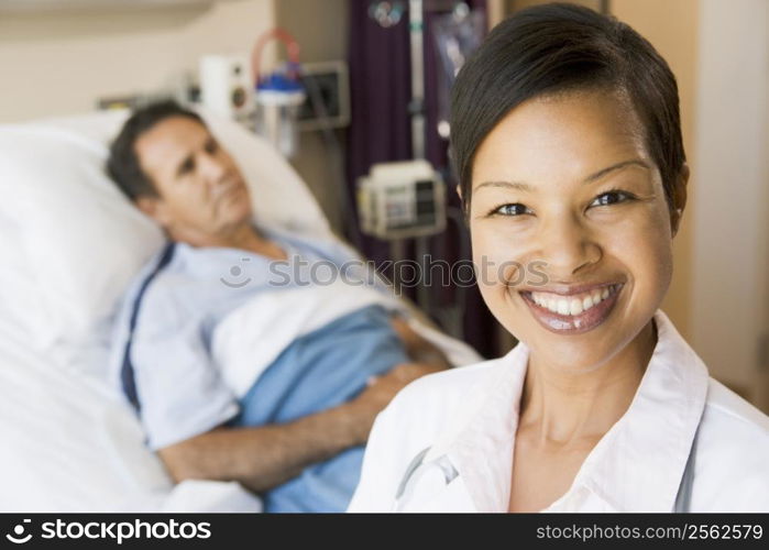 Doctor Smiling In Hospital Room