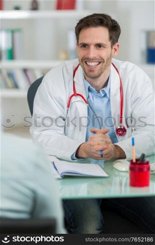 doctor smiling to patient in the clinic