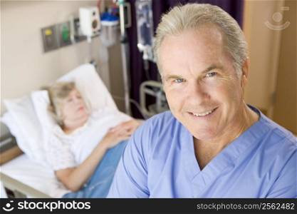 Doctor Standing And Smiling In Patients Room