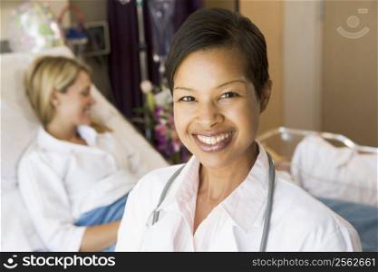 Doctor Standing In Her Patients Room