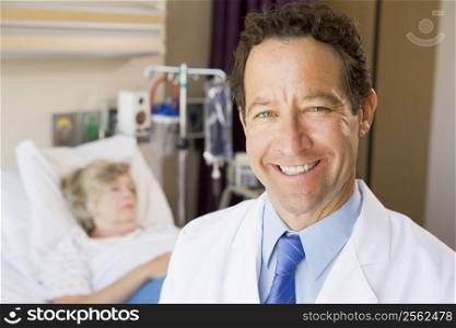 Doctor Standing In Patients Room