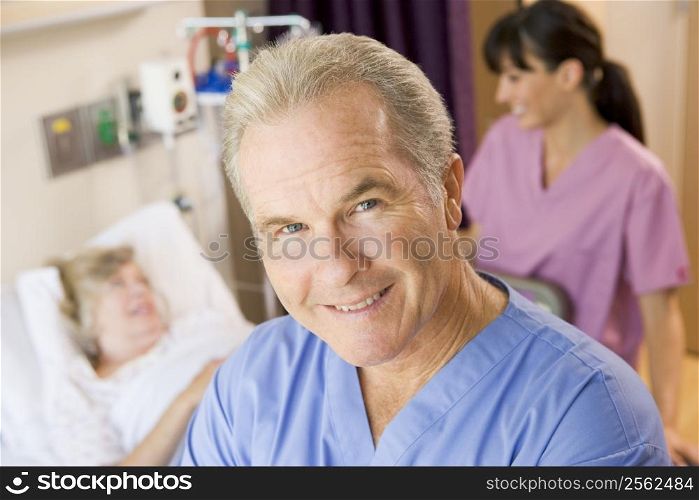 Doctor Standing In Patients Room,Nurse Checking Up On Patient