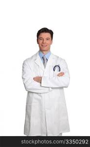 Doctor standing on white background with arms crossed