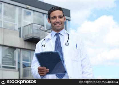 Doctor standing outside hospital