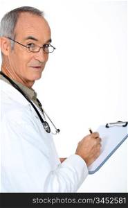 Doctor stood with clipboard