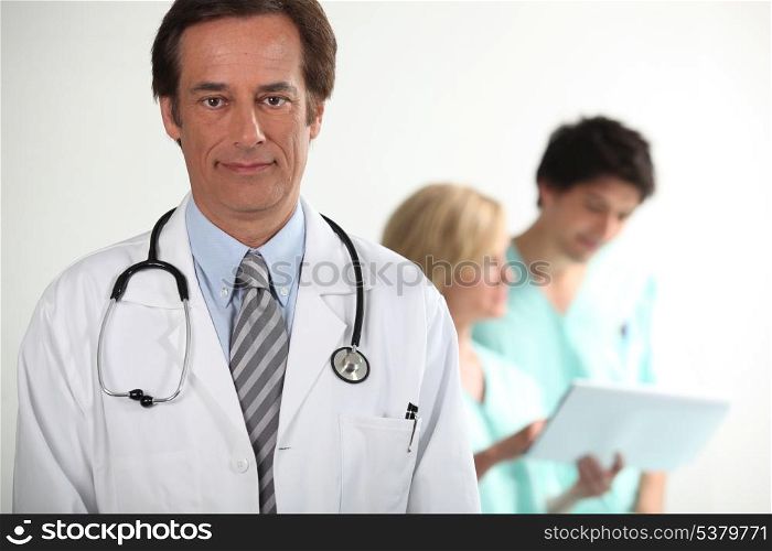 Doctor stood with colleagues
