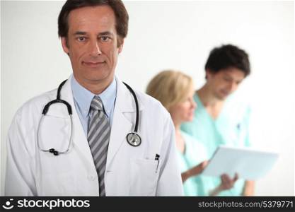 Doctor stood with colleagues