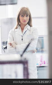 doctor student female researcher holding up a test tube in chemistry bright labaratory