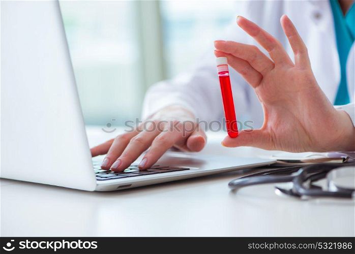 Doctor studying tube of blood in medical concept. The doctor studying tube of blood in medical concept