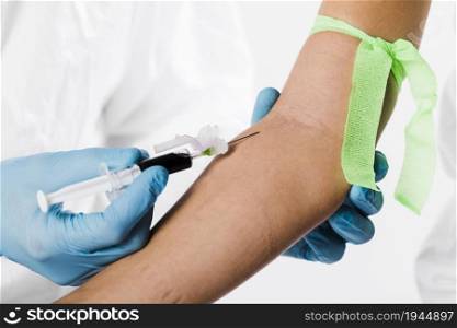 doctor taking blood sample from sick person. High resolution photo. doctor taking blood sample from sick person