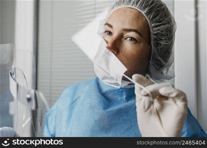doctor taking off her face mask 2