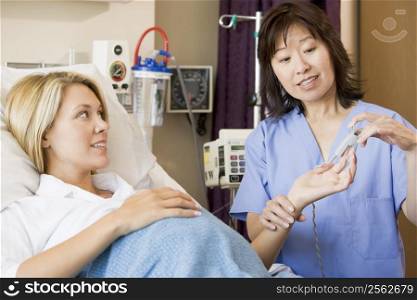 Doctor Taking Pregnant Woman?s Pulse