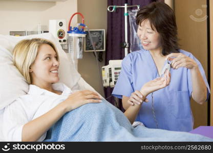 Doctor Taking Pregnant Woman?s Pulse