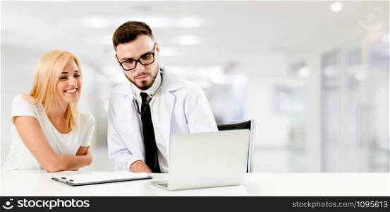 Doctor talking to patient in the hospital. The happy patient is listening to explanation from the doctor. Concept of medical healthcare and doctor staff service.