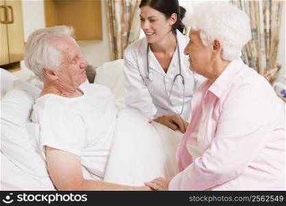 Doctor Talking To Senior Couple