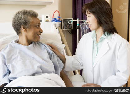 Doctor Talking To Senior Woman