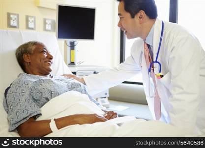 Doctor Talking To Senior Woman In Hospital Room