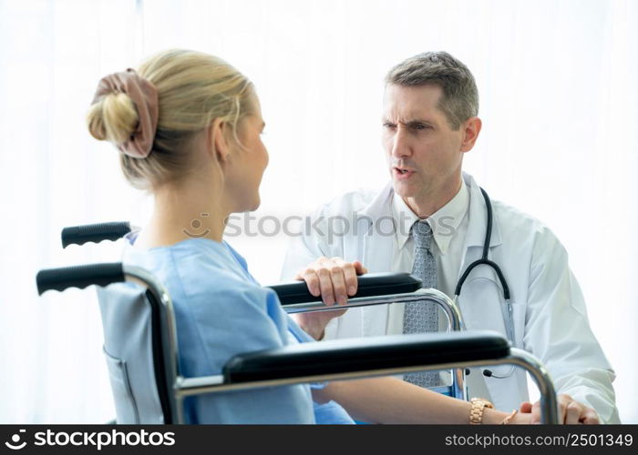 Doctor talking with patient to encouragement,Doctor provide care medical service help support smiling patient at hospital,Coronavirus Disease 2019 (COVID-19).
