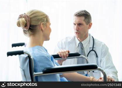 Doctor talking with patient to encouragement,Doctor provide care medical service help support smiling patient at hospital,Coronavirus Disease 2019 (COVID-19).