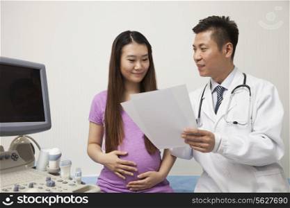 Doctor Talking With Pregnant Woman
