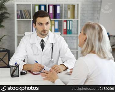 doctor talking woman