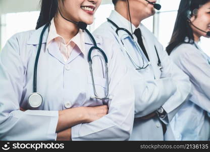 Doctor team wearing headset talking actively on video call in hospital clinic . Concept of telehealth and telemedicine service .. Doctor team wearing headset talking actively on video call in hospital clinic