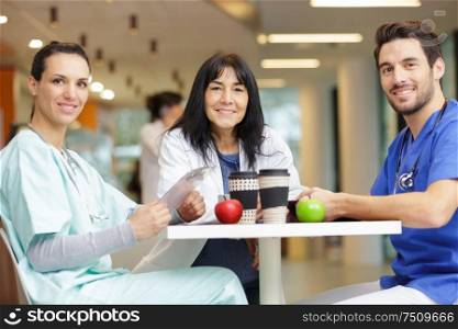 doctor team with apple and coffee