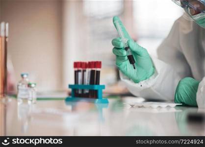 Doctor testing blood sample research vaccine Corona virus
