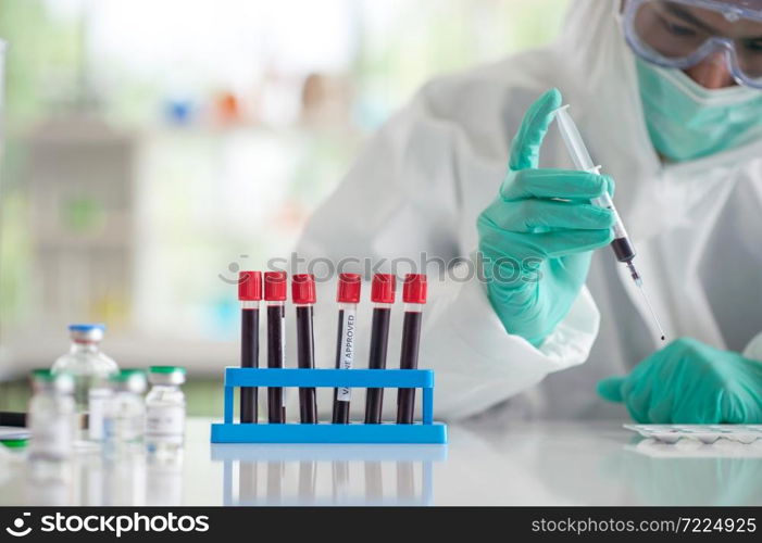 Doctor testing blood sample research vaccine Corona virus