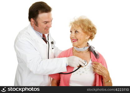 Doctor using a stethoscope to listen to a senior woman&rsquo;s heart beat. Isolated on white.