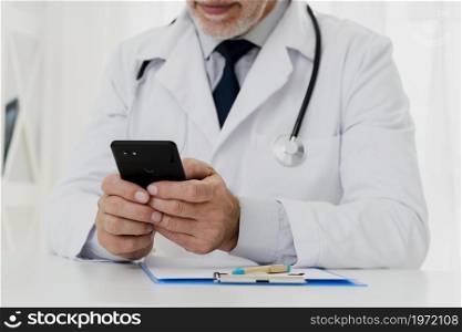doctor using his phone. High resolution photo. doctor using his phone. High quality photo
