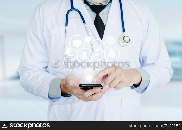 Doctor using smartphone and health care icon on background of Hospital ward